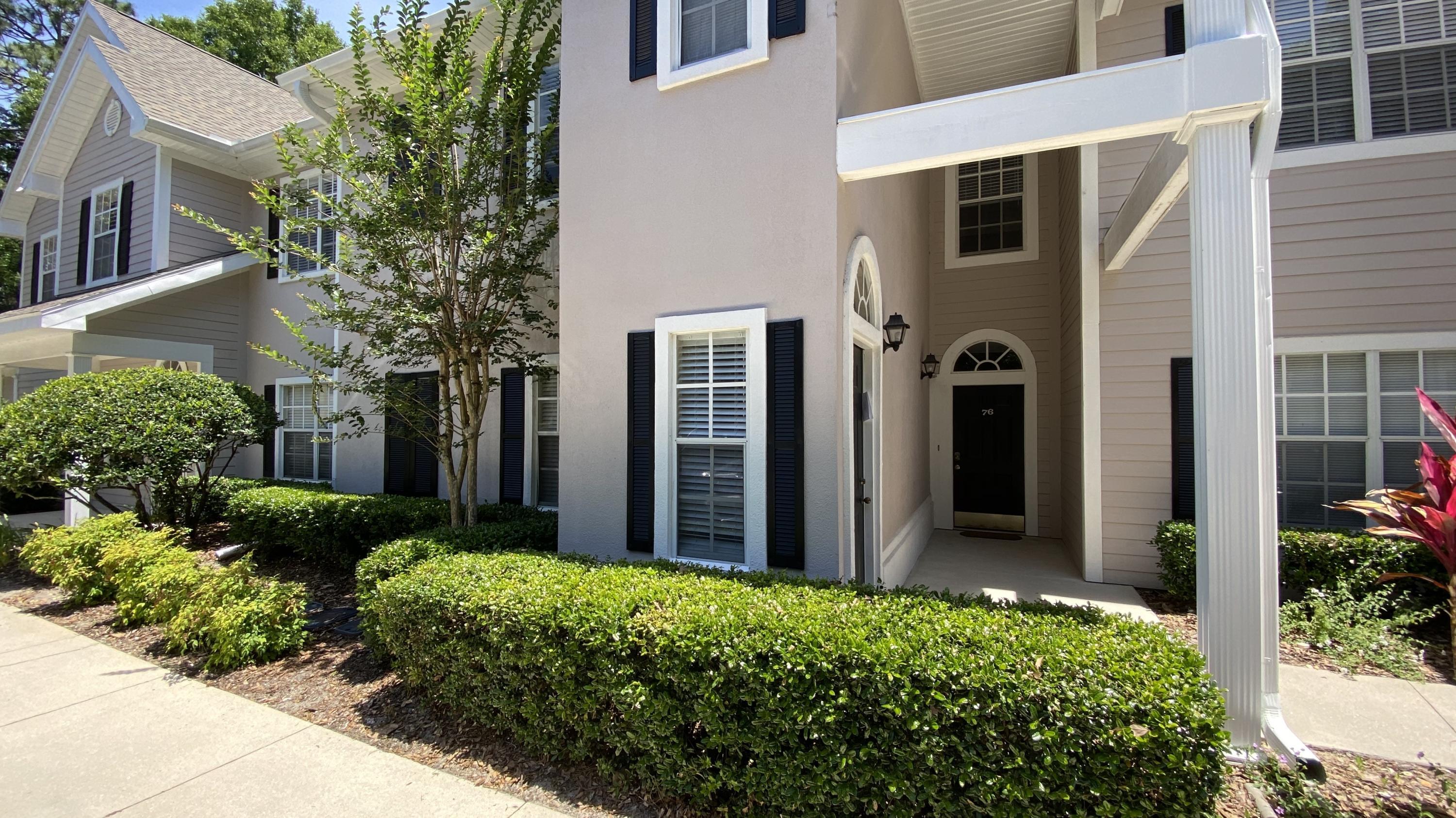 10000 Southwest 52nd Avenue, Unit 76 Gainesville, FL 32608 - Photo 16 of 21 a front view of a house with a yard
