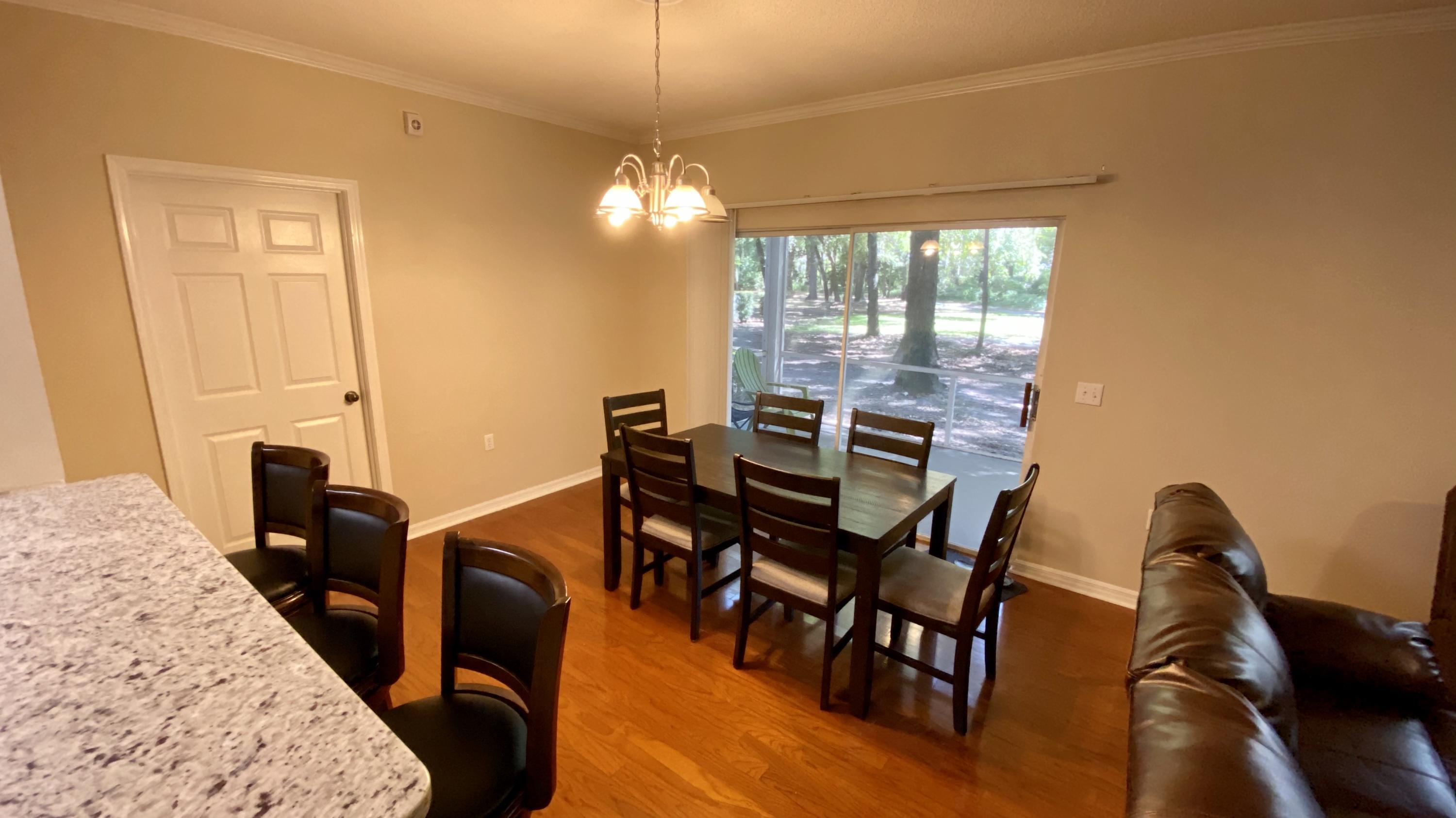 10000 Southwest 52nd Avenue, Unit 76 Gainesville, FL 32608 - Photo 5 of 21 a view of a dining room with furniture window and outside view