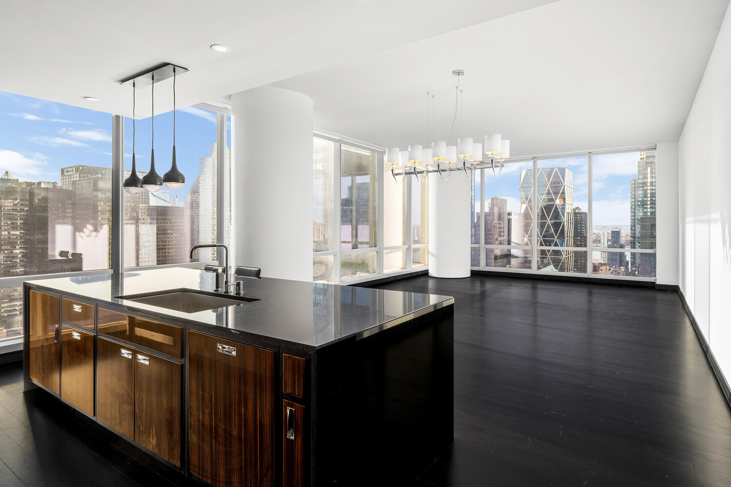 157 West 57th Street, Unit 43B Manhattan, NY 10019 - Photo 1 of 10 a kitchen with a sink and window