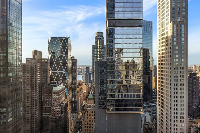 a view of a living room with hardwood floor and window