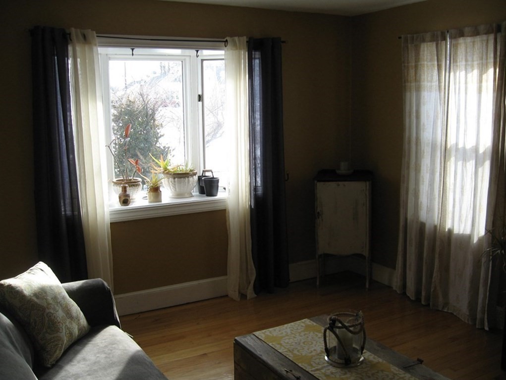 95 Grandview Street Springfield, MA 01118 - Photo 14 of 30 a living room with furniture and a window