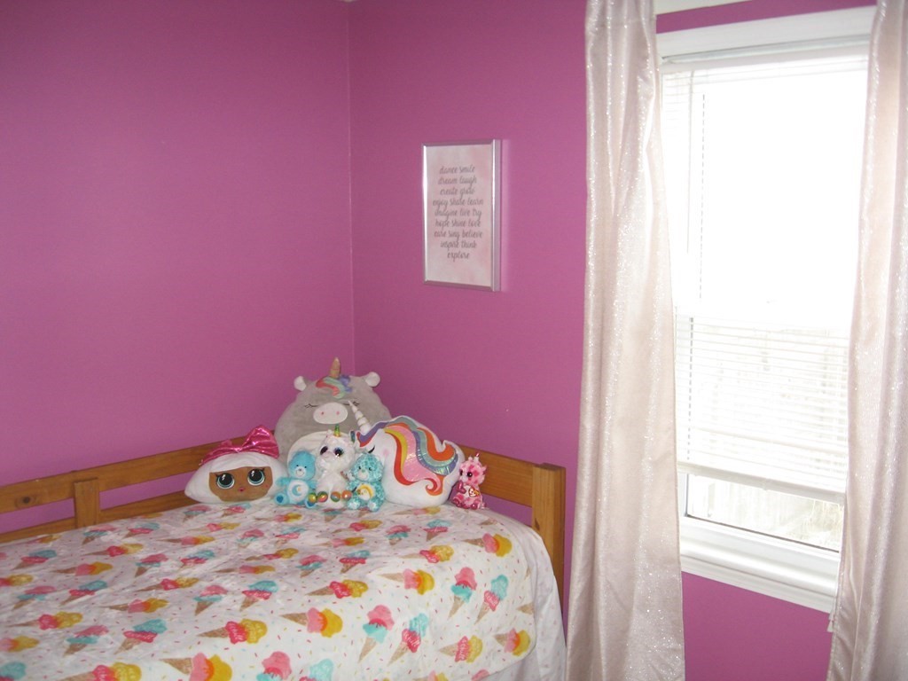 95 Grandview Street Springfield, MA 01118 - Photo 18 of 30 a bedroom with a bed and a dresser in it
