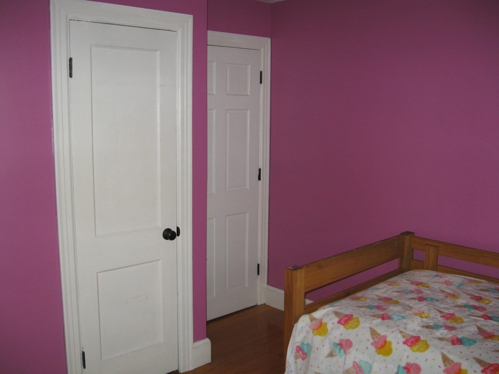 95 Grandview Street Springfield, MA 01118 - Photo 19 of 30 a bedroom with a bed and a dresser