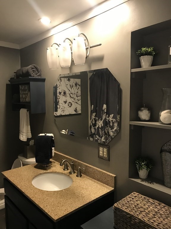 95 Grandview Street Springfield, MA 01118 - Photo 21 of 30 a bathroom with a sink vanity and a mirror