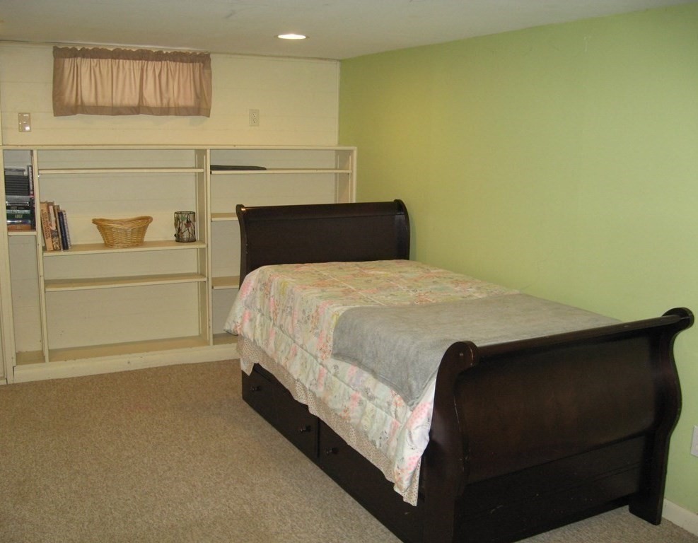 95 Grandview Street Springfield, MA 01118 - Photo 24 of 30 a bedroom with a bed and a night stand