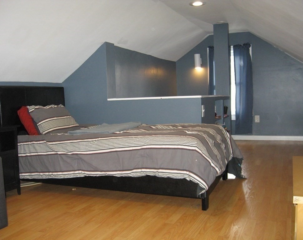 95 Grandview Street Springfield, MA 01118 - Photo 25 of 30 a bedroom with a bed and a mirror