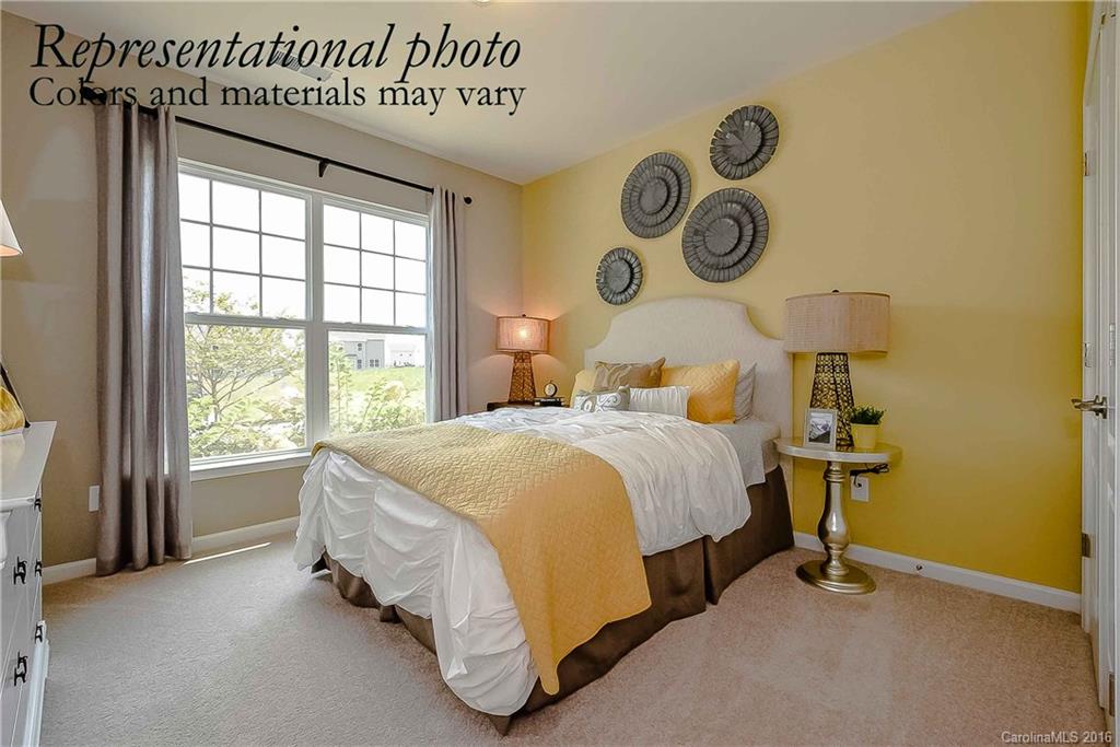 79175 Ridgehaven Road, Unit 151 Lancaster, SC 29720 - Photo 2 of 20 a spacious bedroom with a bed and a window