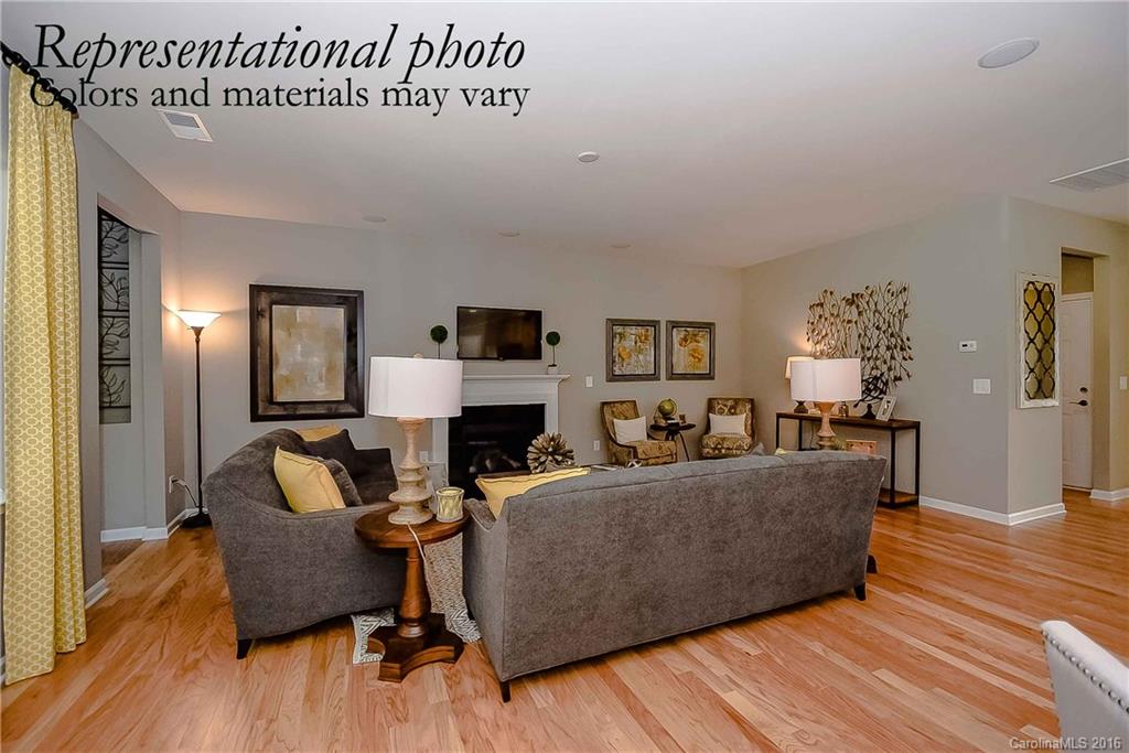 79175 Ridgehaven Road, Unit 151 Lancaster, SC 29720 - Photo 13 of 20 a living room with furniture and a wooden floor