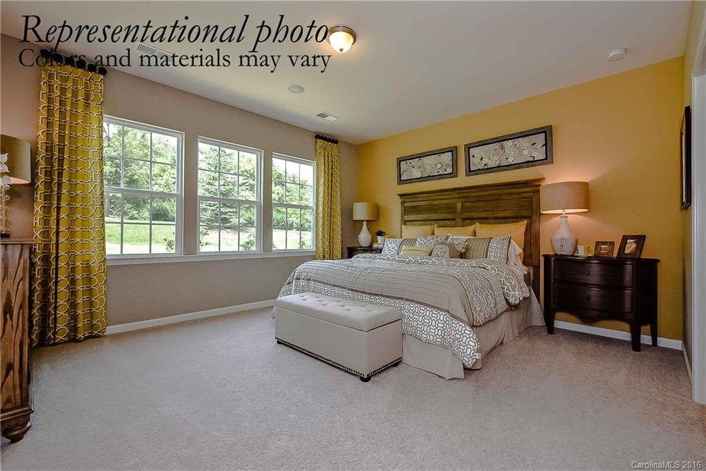 79175 Ridgehaven Road, Unit 151 Lancaster, SC 29720 - Photo 14 of 20 a bedroom with a bed and a night stand