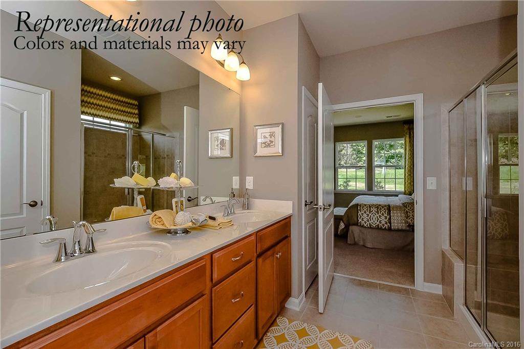 79175 Ridgehaven Road, Unit 151 Lancaster, SC 29720 - Photo 17 of 20 a en suite bathroom with sinks mirror and view bedroom
