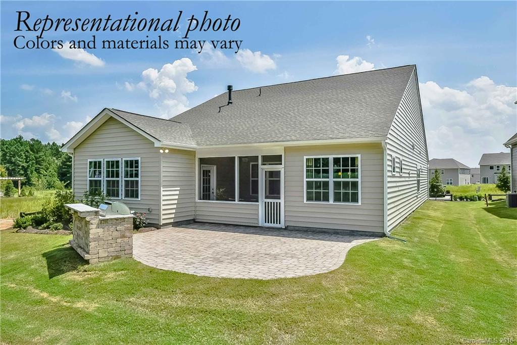 79175 Ridgehaven Road, Unit 151 Lancaster, SC 29720 - Photo 20 of 20 a front view of a house with a yard and outdoor seating