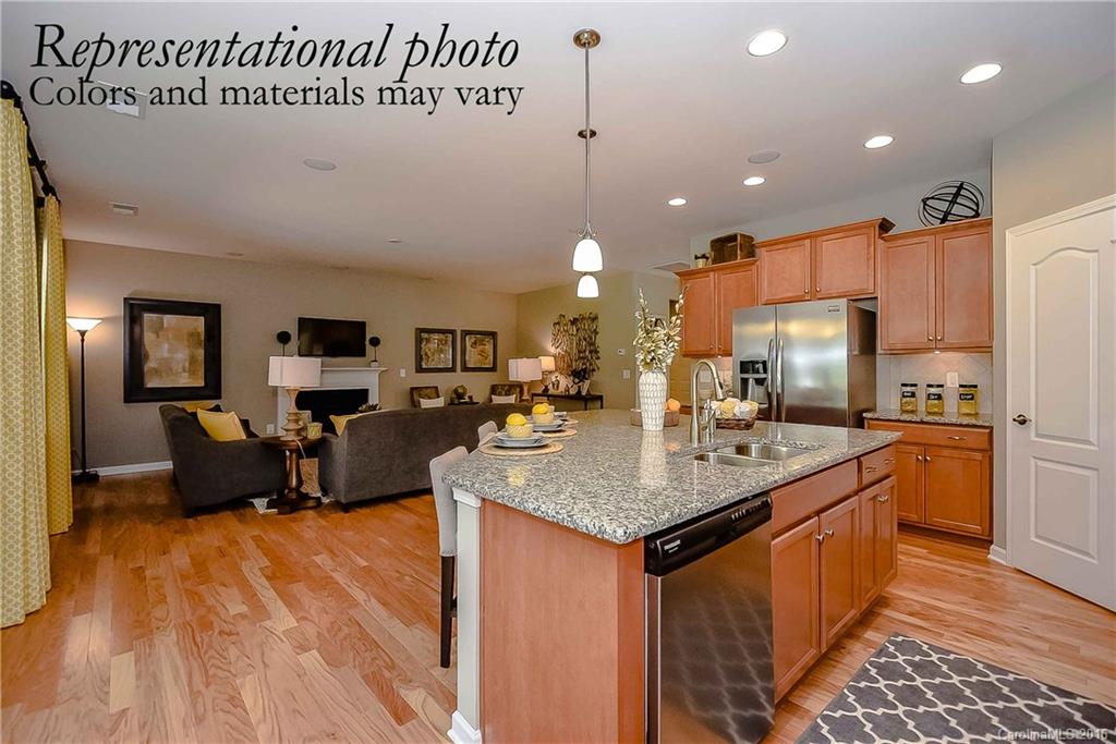 79175 Ridgehaven Road, Unit 151 Lancaster, SC 29720 - Photo 8 of 20 a kitchen with stainless steel appliances granite countertop a sink a counter top space cabinets and wooden floor