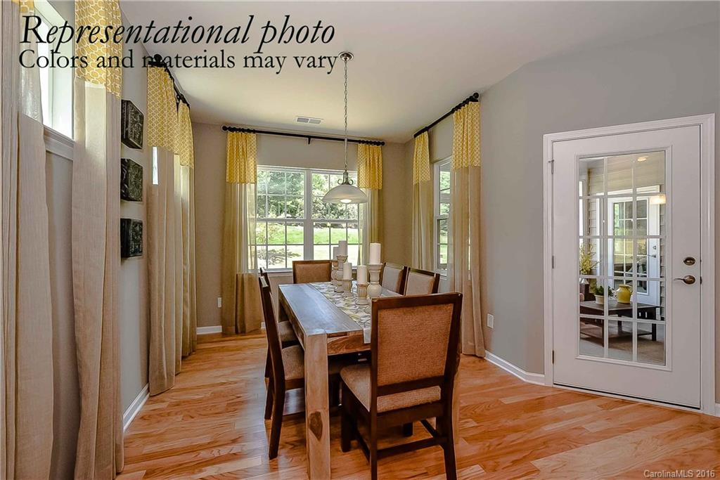 79175 Ridgehaven Road, Unit 151 Lancaster, SC 29720 - Photo 9 of 20 a view of a dining room with furniture window and wooden floor