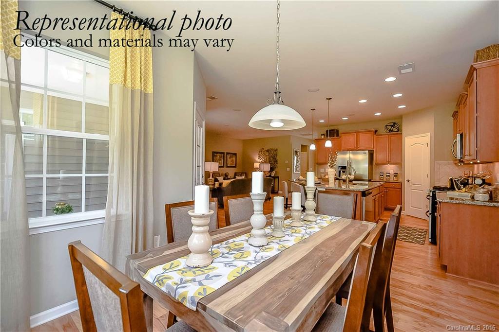 79175 Ridgehaven Road, Unit 151 Lancaster, SC 29720 - Photo 10 of 20 a view of a dining room with furniture window and wooden floor