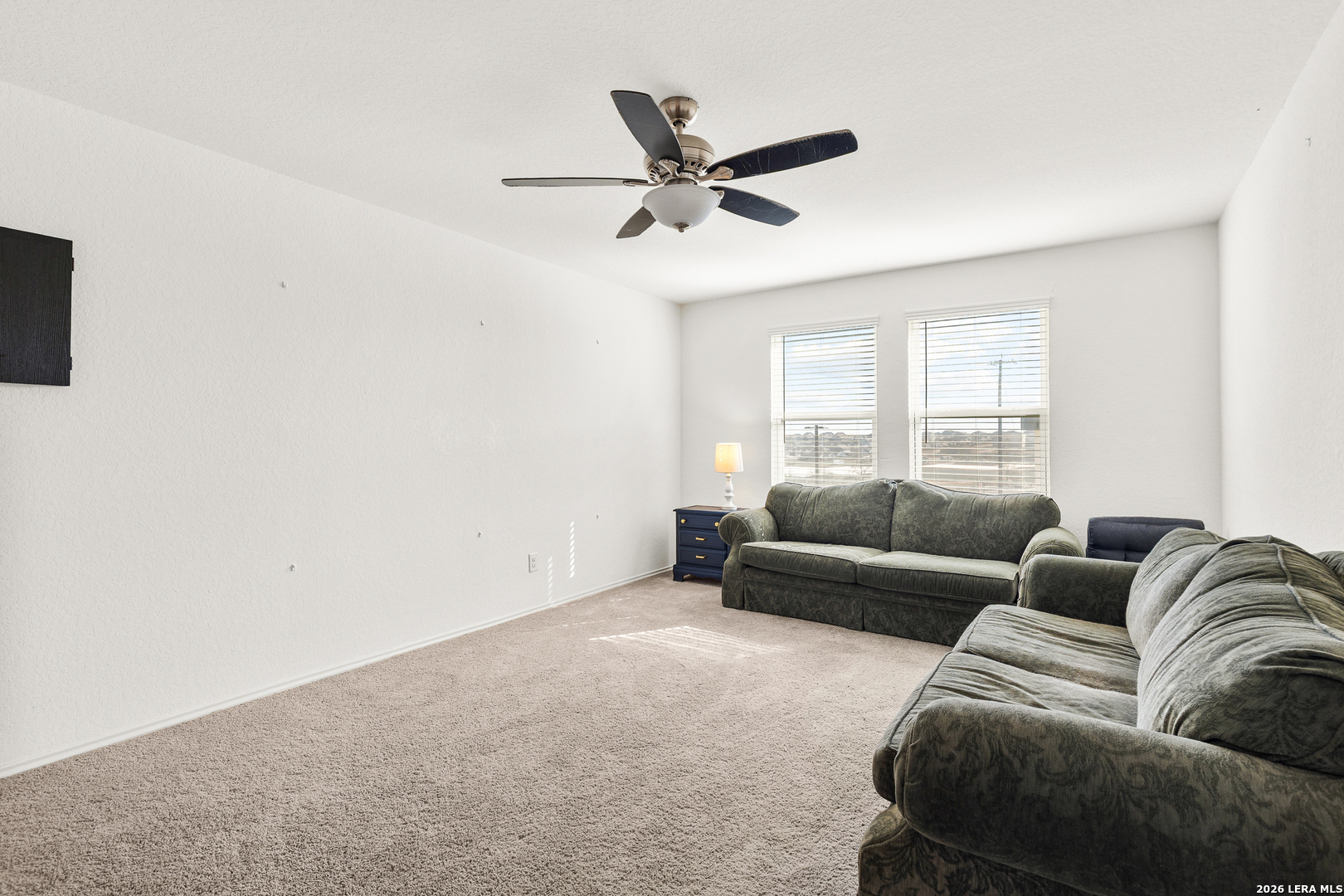 5802 Rue Picasso Converse, TX 78109 - Photo 11 of 23 a living room with furniture and a window