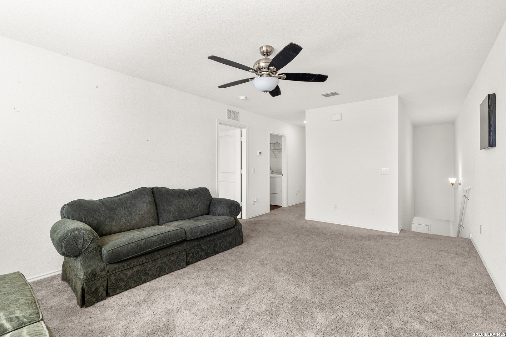 5802 Rue Picasso Converse, TX 78109 - Photo 12 of 23 a living room with furniture and a ceiling fan
