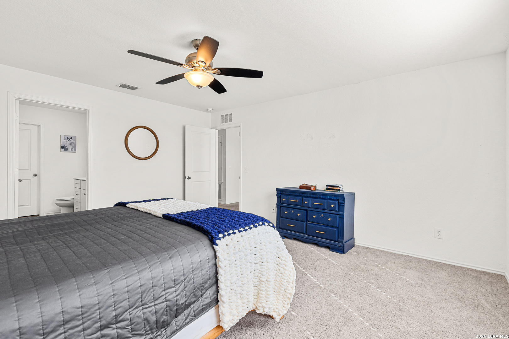 5802 Rue Picasso Converse, TX 78109 - Photo 15 of 23 a bedroom with a bed and a dresser