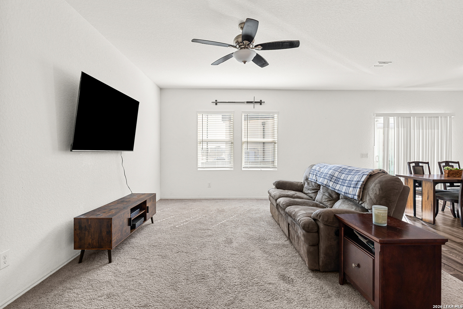5802 Rue Picasso Converse, TX 78109 - Photo 2 of 23 a living room with furniture and a flat screen tv