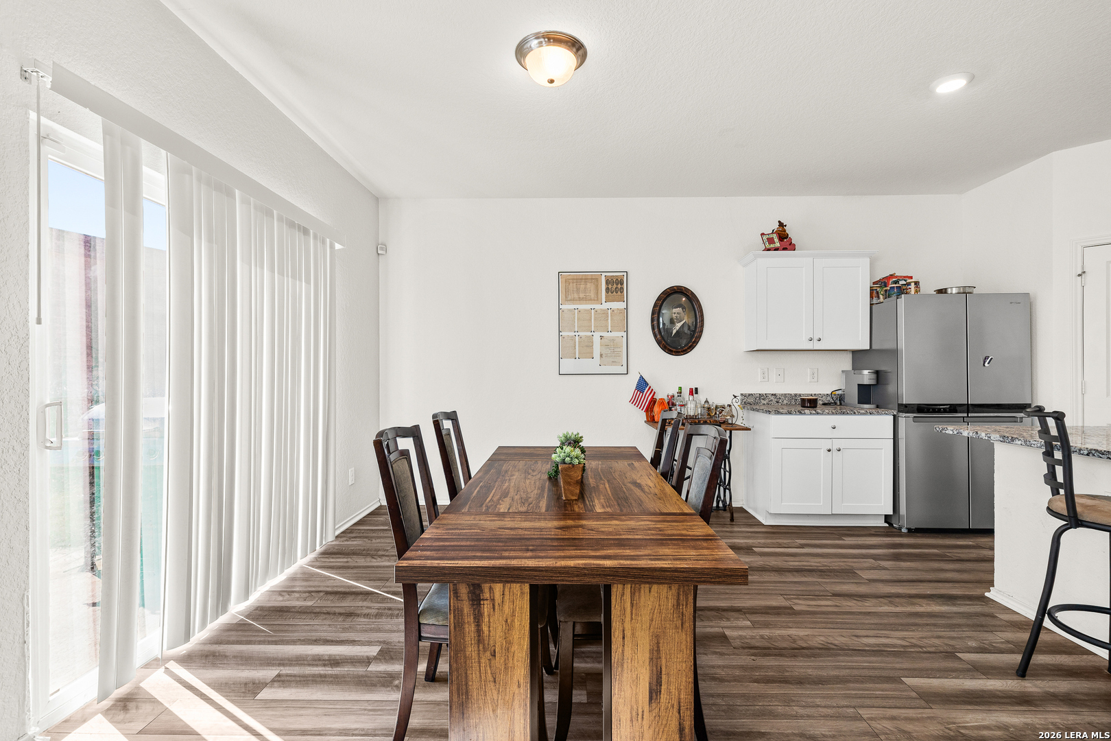 5802 Rue Picasso Converse, TX 78109 - Photo 4 of 23 a kitchen with kitchen island stainless steel appliances a stove and a refrigerator
