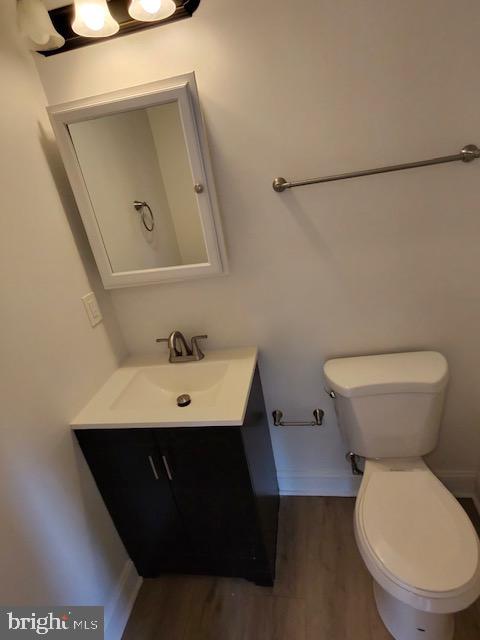 317 Decatur Street Northwest, Unit 4 Washington, DC 20011 - Photo 14 of 19 a bathroom with a toilet sink and mirror