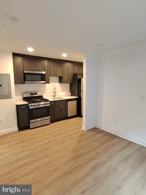 317 Decatur Street Northwest, Unit 4 Washington, DC 20011 - Photo 2 of 19 a kitchen with stainless steel appliances granite countertop a stove and a sink