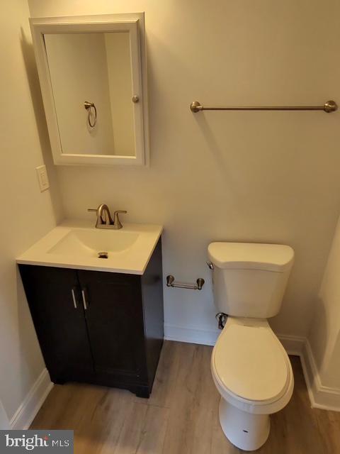 317 Decatur Street Northwest, Unit 4 Washington, DC 20011 - Photo 7 of 19 a bathroom with a sink toilet and mirror