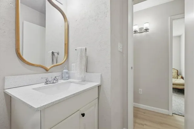 a bathroom with a sink and a mirror