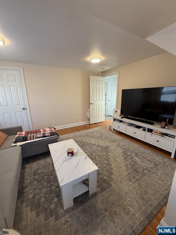 337 2nd Street Saddle Brook, NJ 07663 - Photo 6 of 9 a living room with a flat screen tv and a couch