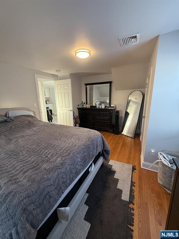 337 2nd Street Saddle Brook, NJ 07663 - Photo 8 of 9 a bedroom with a bed a couch and dresser