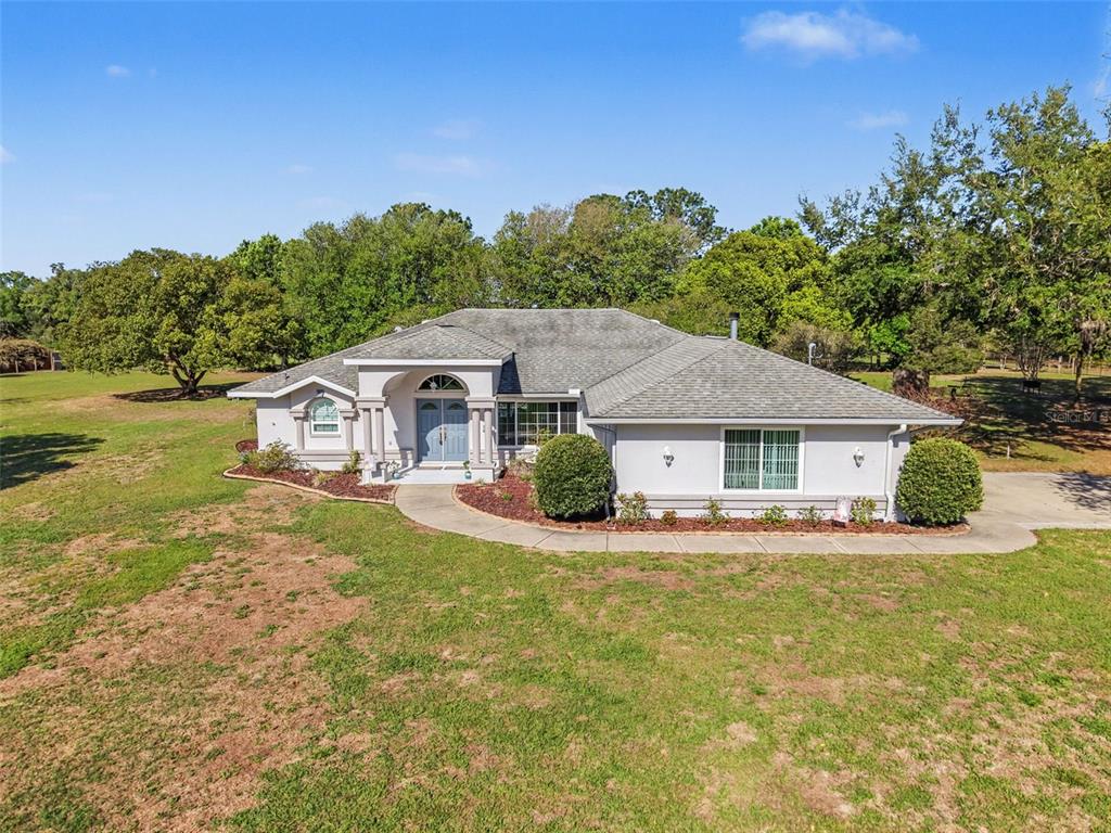 4221 Neff Lake Road Brooksville, FL 34602 - Photo 1 of 1 front view of a house with a big yard