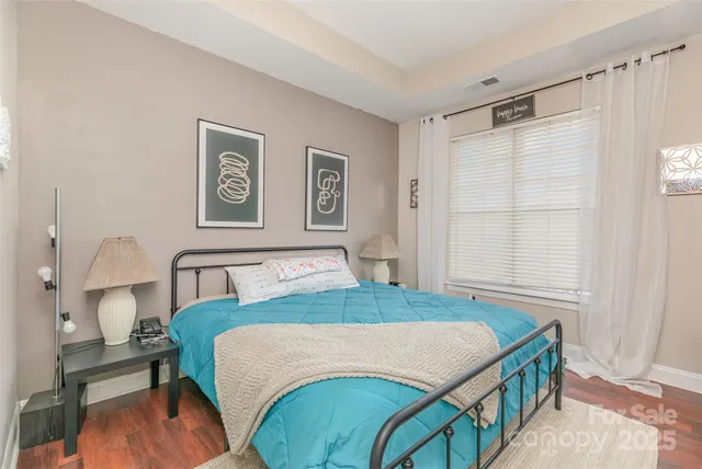 a bedroom with a bed and a table in it