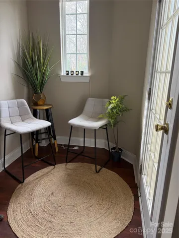 a workspace with furniture and a potted plant