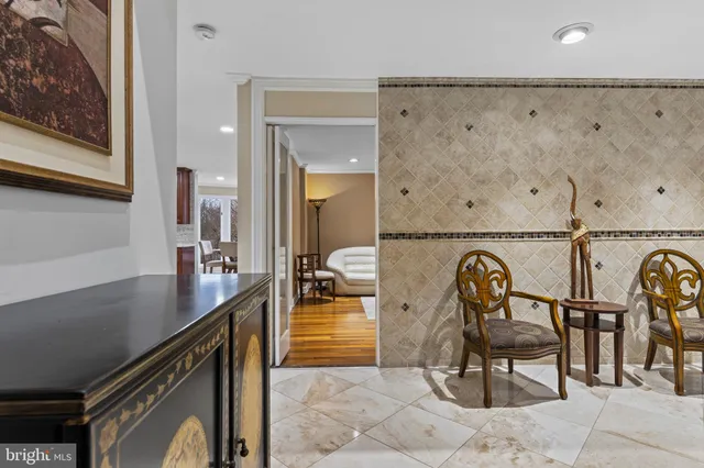 a kitchen with stainless steel appliances granite countertop wooden cabinets a sink and a stove