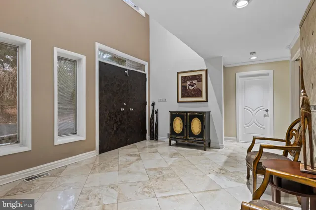 a kitchen with granite countertop a sink stainless steel appliances and cabinets
