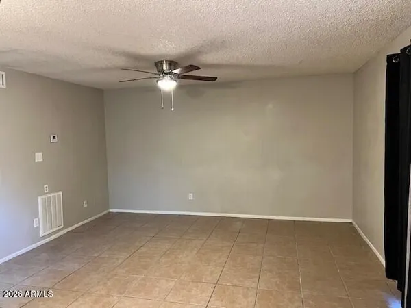 a view of empty room with windows