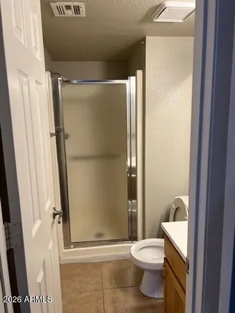 a white toilet sitting next to a bathroom sink