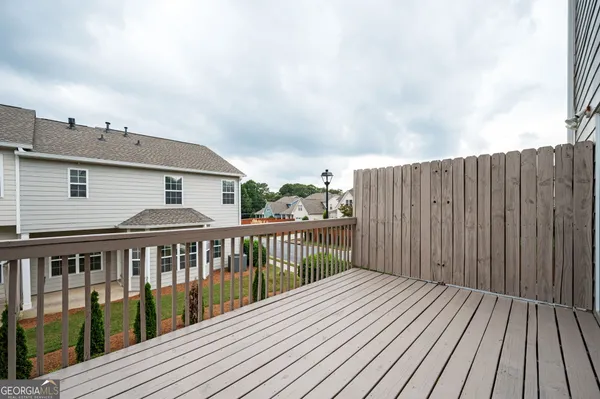 a view of a house with a yard and sitting space