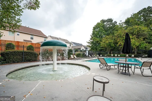 a view of a swimming pool with a patio