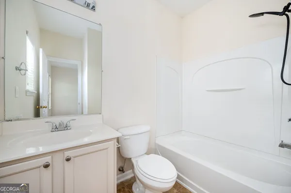 an empty room with a empty space and windows