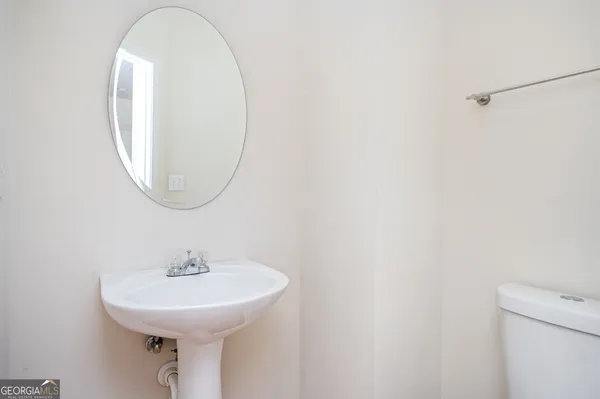 a kitchen with granite countertop a refrigerator stove top oven and sink