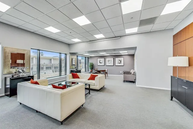 a living room with furniture and flat screen tv