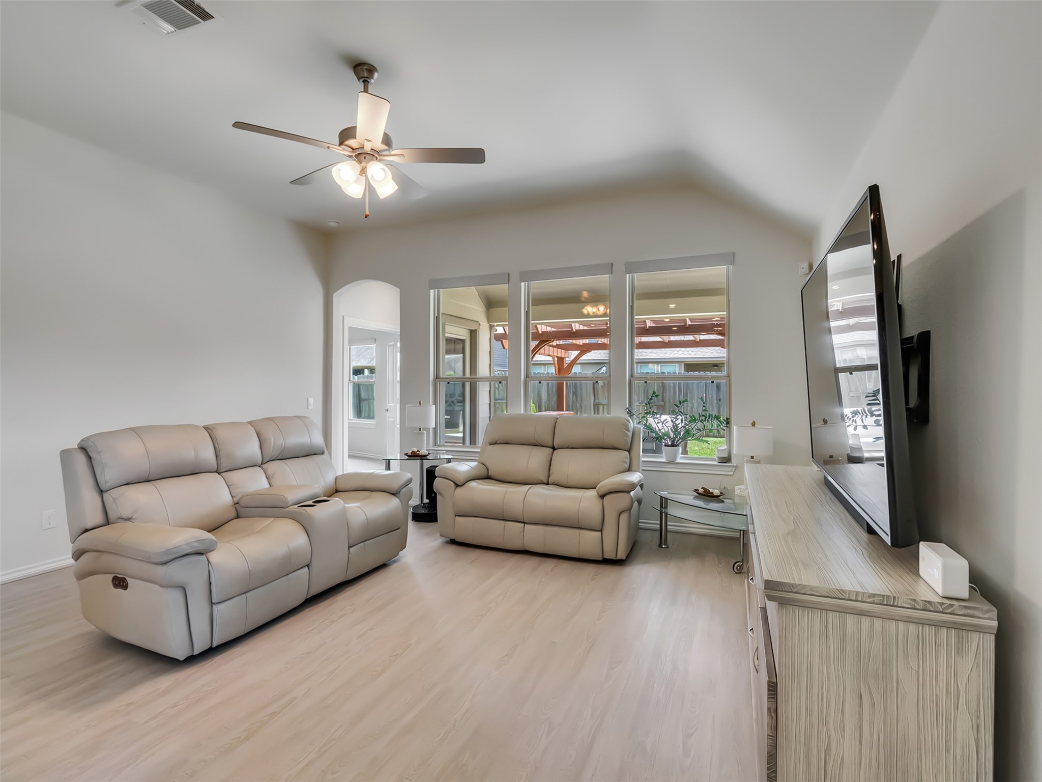 27997 Lone Hollow Lane Spring, TX 77386 - Photo 29 of 45 a living room with furniture and a flat screen tv