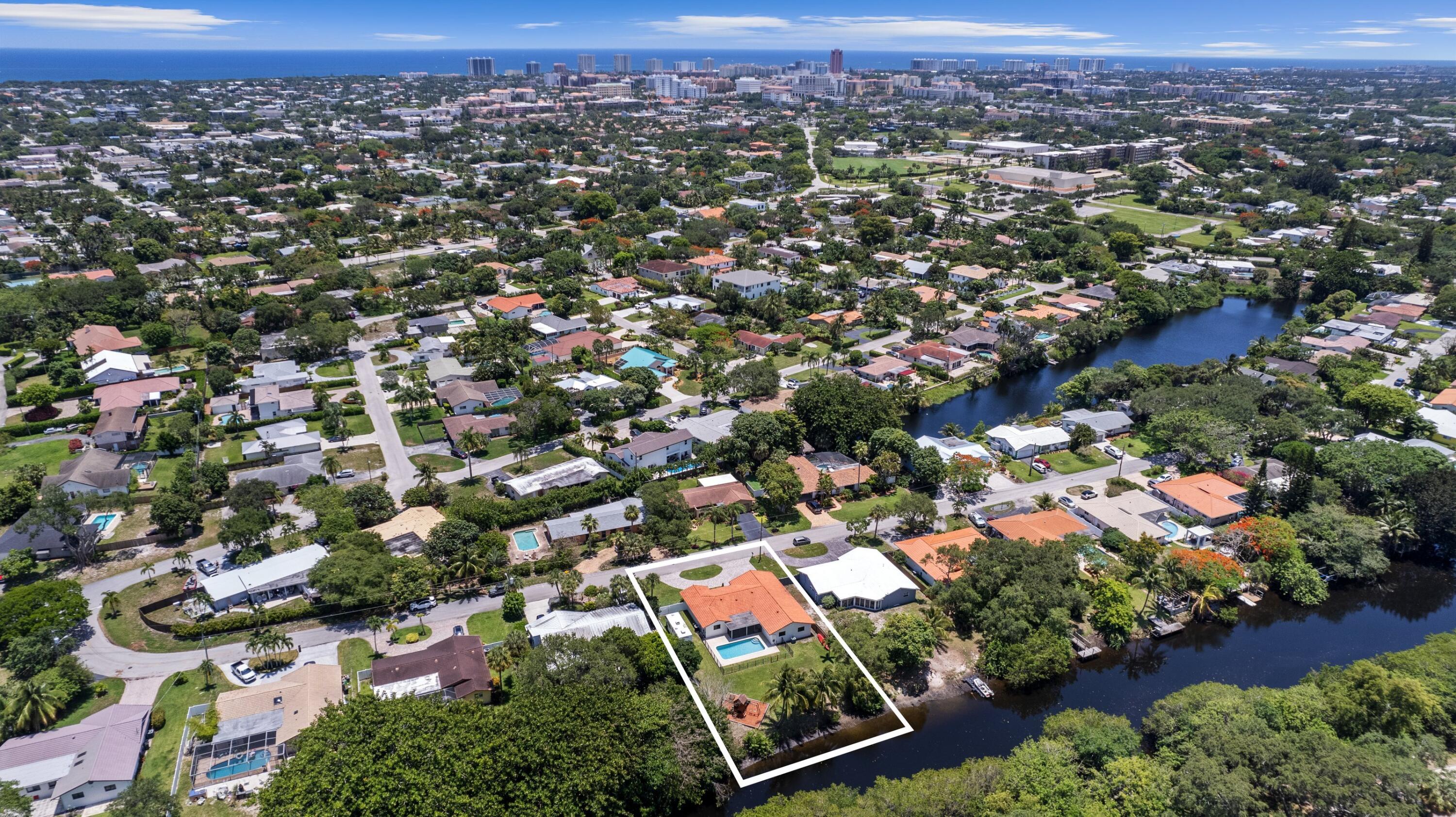1151 Northwest 6th Avenue Boca Raton, FL 33432 - Photo 1 of 42 an aerial view of residential houses with outdoor space and trees