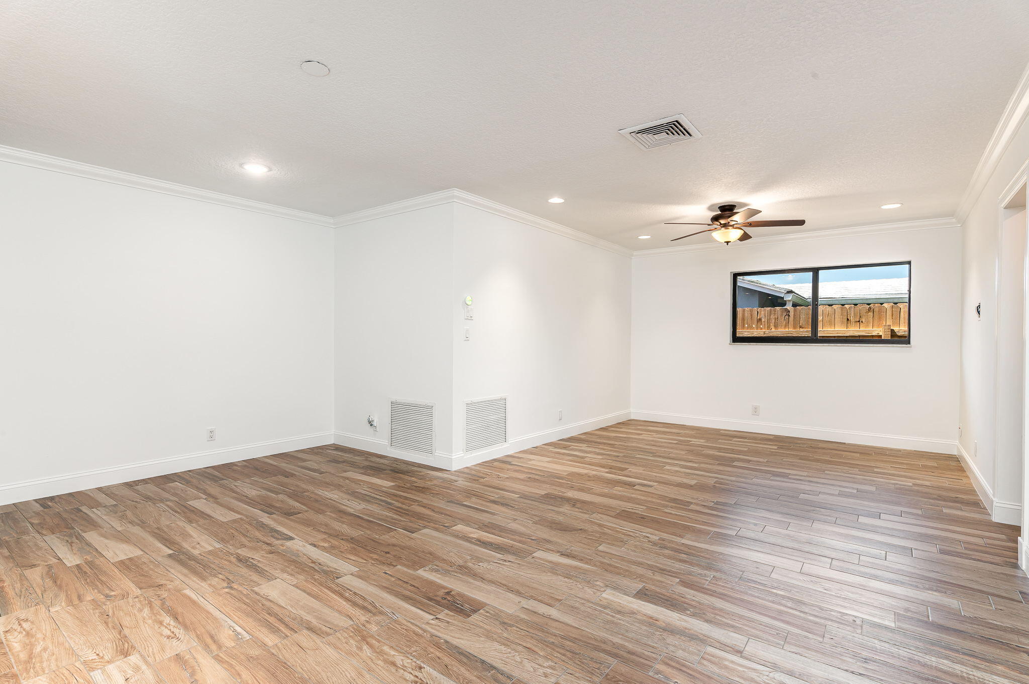1151 Northwest 6th Avenue Boca Raton, FL 33432 - Photo 11 of 42 a view of empty room with wooden floor