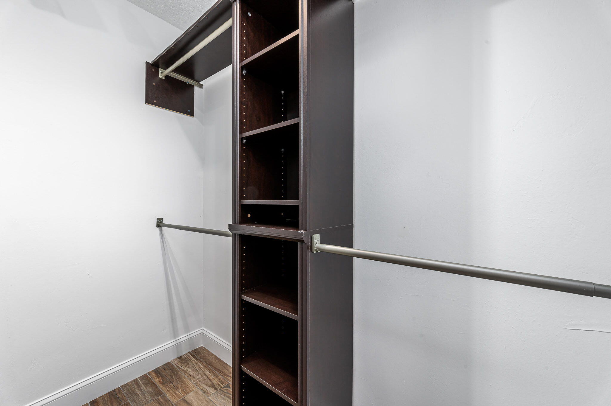 1151 Northwest 6th Avenue Boca Raton, FL 33432 - Photo 13 of 42 a view of walk in closet with clothes and shoes