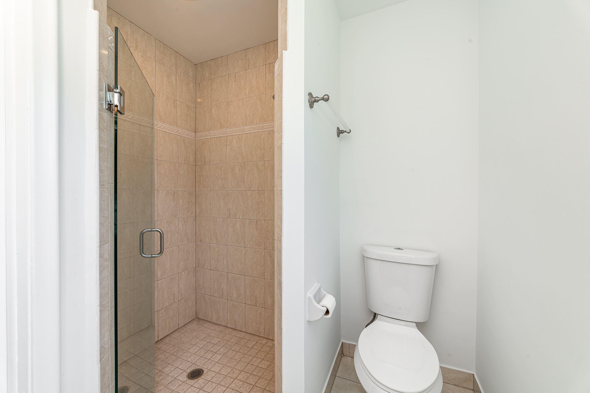1151 Northwest 6th Avenue Boca Raton, FL 33432 - Photo 15 of 42 a bathroom with a toilet and a shower