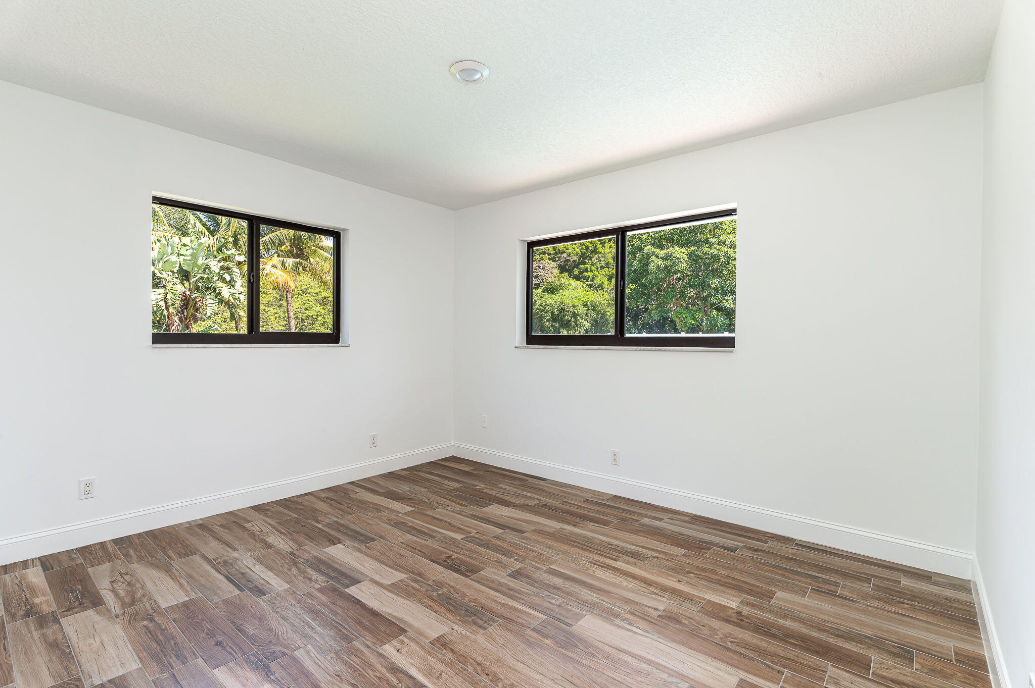 1151 Northwest 6th Avenue Boca Raton, FL 33432 - Photo 16 of 42 a view of empty room with wooden floor