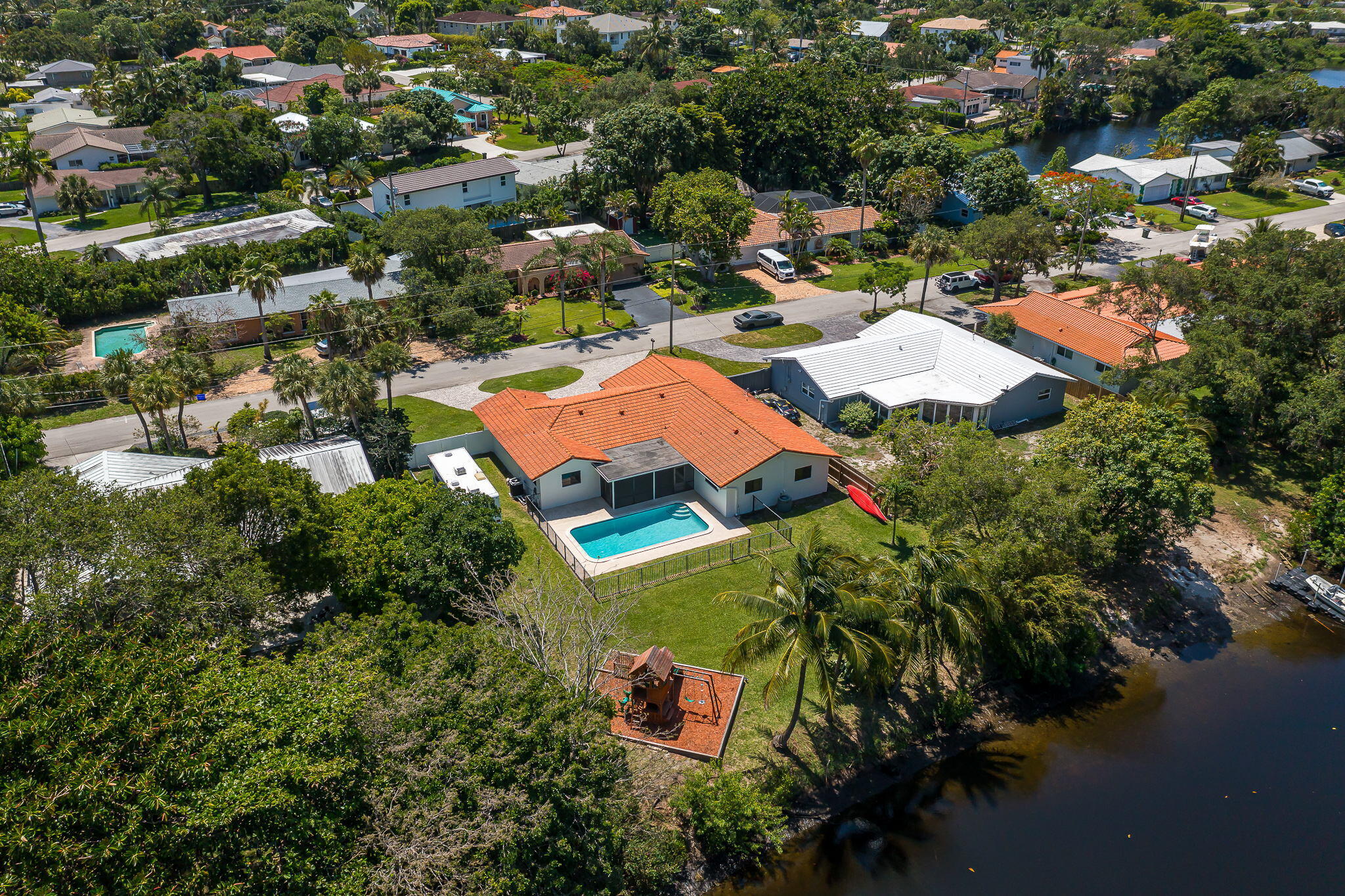 1151 Northwest 6th Avenue Boca Raton, FL 33432 - Photo 26 of 42 an aerial view of residential houses with outdoor space and trees