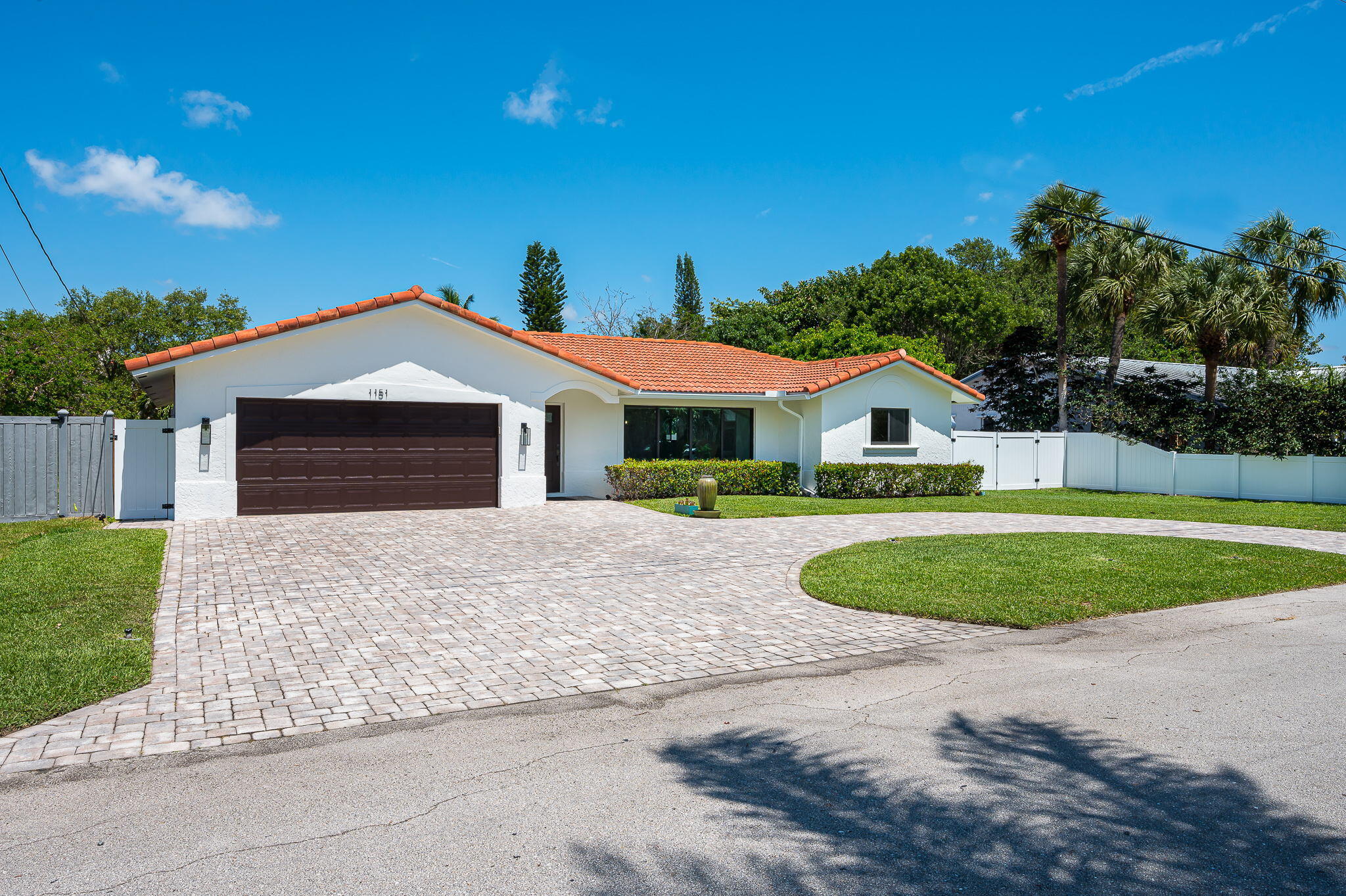 1151 Northwest 6th Avenue Boca Raton, FL 33432 - Photo 27 of 42 a front view of a house with garage