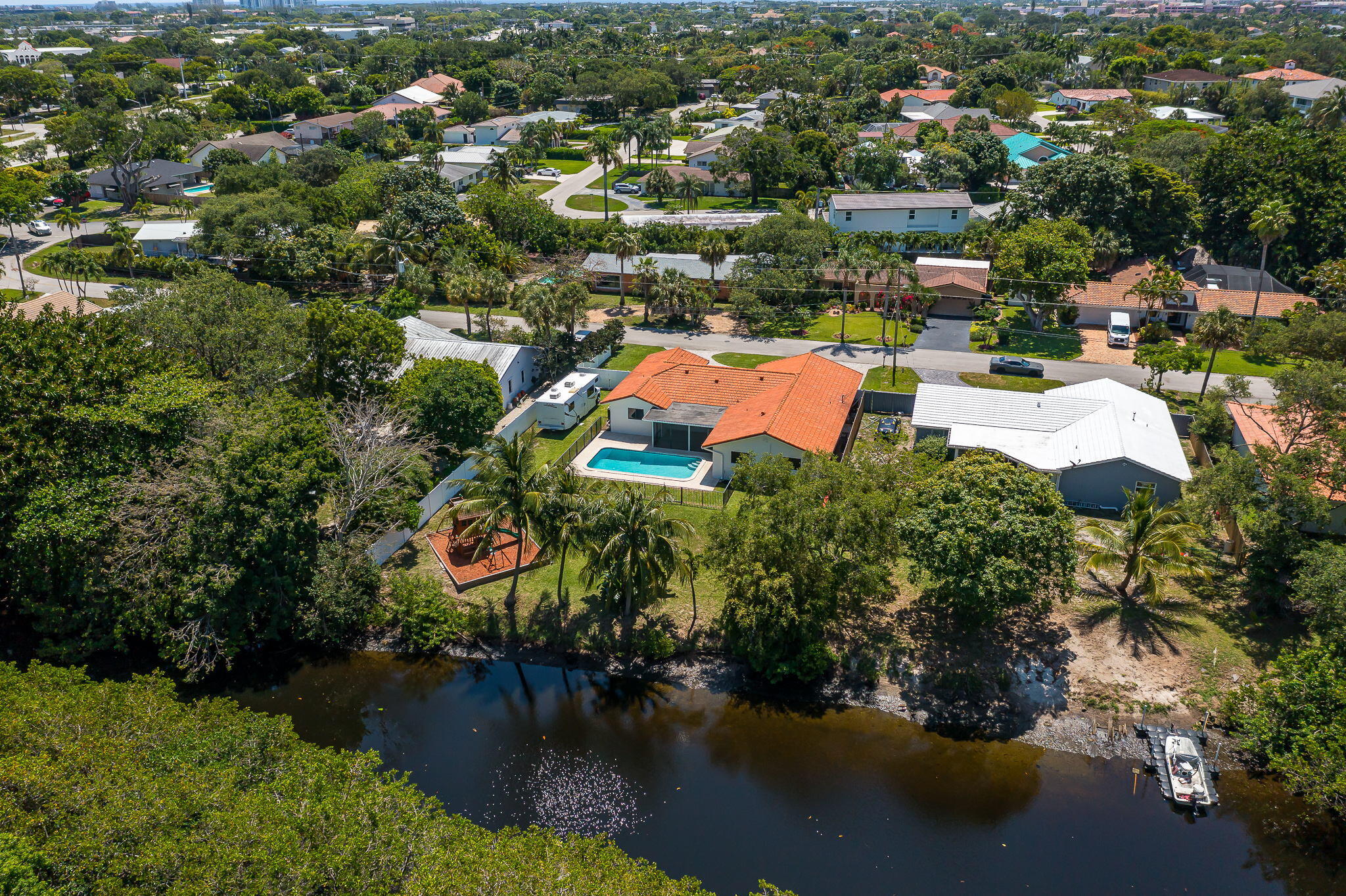 1151 Northwest 6th Avenue Boca Raton, FL 33432 - Photo 28 of 42 an aerial view of residential houses with outdoor space and swimming pool